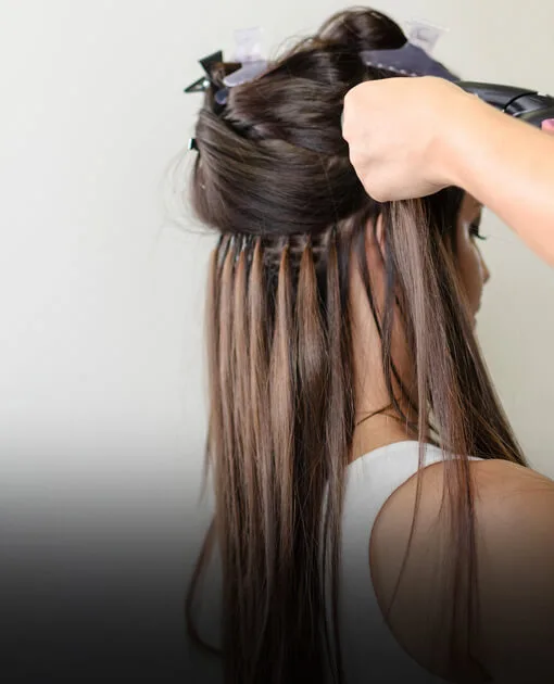 Hair extensions being fitted at Vintage Park Salon