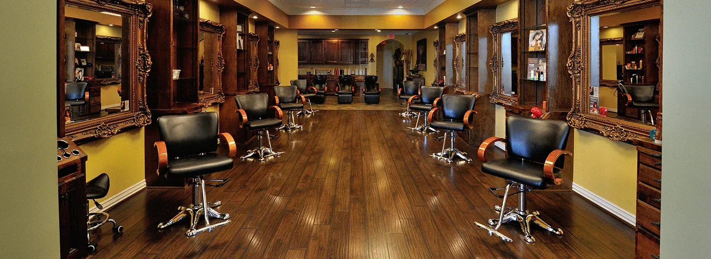 The salon floor at Vintage Park Salon with gilded vintage mirrors